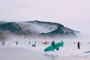 Beginners and Surfers Catching Waves poster prints and canvas art