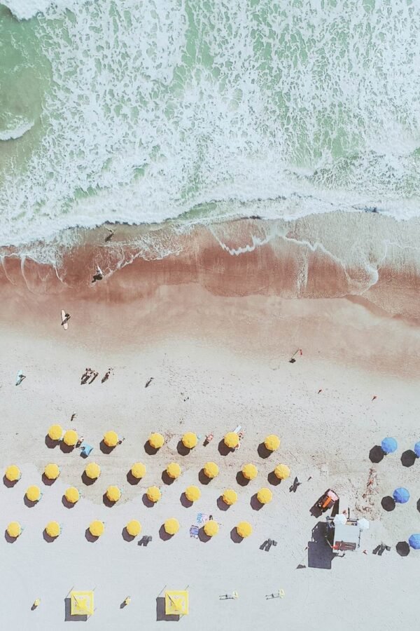 Ocean Waves on Beach and Umbrellas Aerial View picture framed poster and coastal landscape canvas wall art print