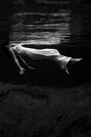 Black and White Underwater View of a Woman Photography Print framed poster and canvas wall art