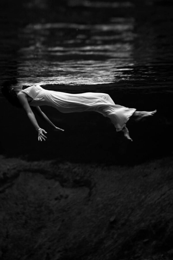 Black and White Underwater View of a Woman Photography Print framed poster and canvas wall art